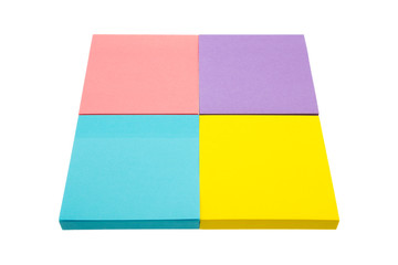 Four color block of paper notes isolated white background.