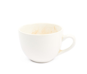 Cup with coffee leftovers isolated
