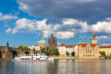 Obraz premium Prague, Czech Republic, Charles Bridge across Vltava river on which the ship sails