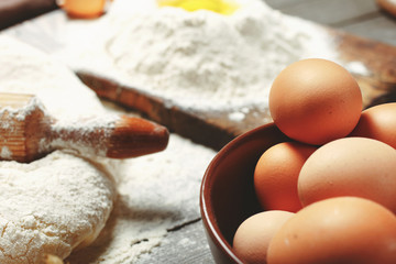 Fototapeta na wymiar Brown eggs in a bowl close up in a bakery