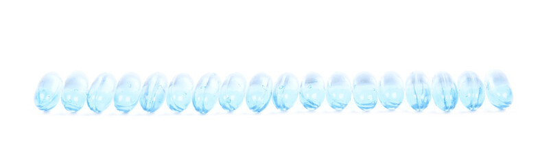 Line of multiple softgel pills isolated