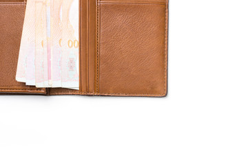 Thai cash in brown leather wallet isolated on white background