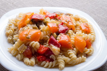 Italian pasta fusilli with vegetable sauce closeup