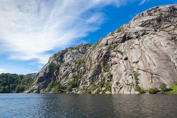 Norway, Scandinavia. Beautiful landscape on the lake shore middle of the stone mountains. blue sky