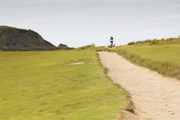 Cyclists on a costal path in Cornwall