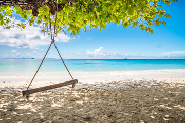 Swing in beautiful tropical island white sand beach summer holiday - Travel summer vacation concept.	
