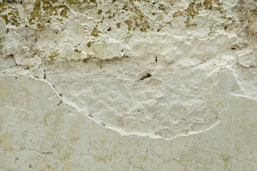 Wall fragment with attritions and cracks