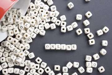 Online word written on wood block. Wooden ABC.