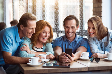 Group of friends using phone