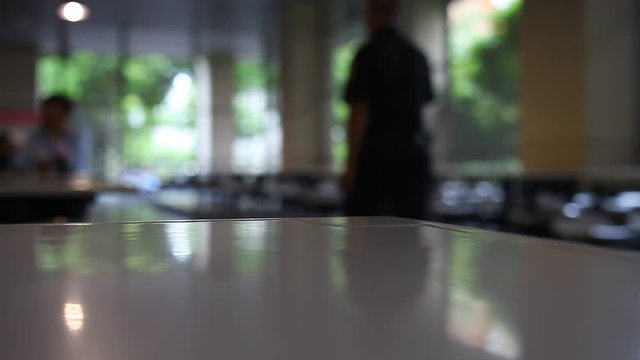 table and chair at food court blurred background