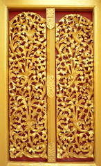 gold door of the temple is very beautiful pattern Lai Kanok (Thai design) carved wood.