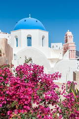 Flowers in front of an orthodox church in Santorini