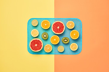 Fashion. Tropical Fruit Citrus, Orange, Grapefruit Lime Kiwi. Fashion woman Glamor Wrist Watches, Trendy Gumshoes. Stylish girl. Fashion creative concept. Minimal Art