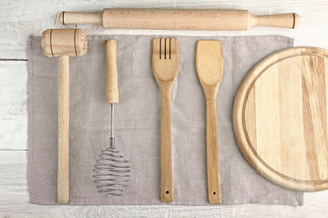 Set of wooden kitchen utensils on a napkin
