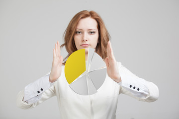Woman shows a pie chart, circle diagram. Business analytics concept.