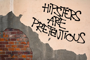 Hipsters Are Pretentious - handwritten graffiti sprayed on the wall, anarchist aesthetics -...