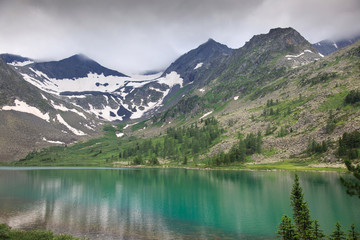 Clear mountain lake on a cloudy day, Altai.