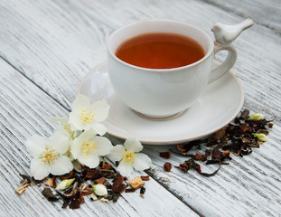 Cup of tea with jasmine flowers