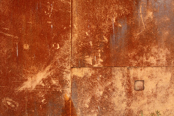 Red and brown rust on metal plate