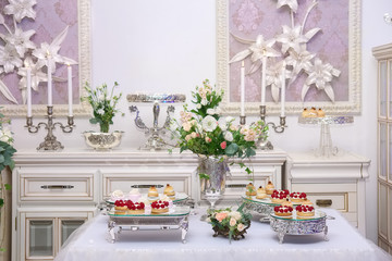 Dessert table for a wedding party. Delicious sweet buffet with c