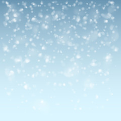 Naklejka na ściany i meble Falling flakes of snow on light blue background