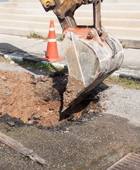 Excavator working on the Repair