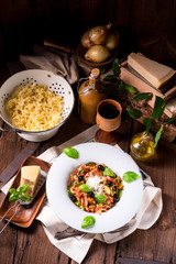 Ribbon Pasta with zucchini and olives in tomato sauce