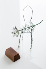 Toy chair with flower and chocolate candy