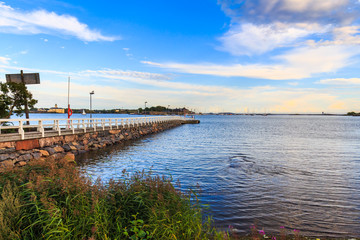 Fototapeta premium Sea pier landscape, old wooden pier and blue sky