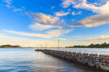 Sea pier landscape, old wooden pier and blue sky