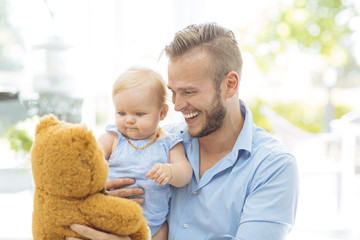 Dad playing with his daughter