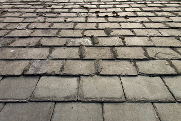 close-up of aged slate roof tiles 