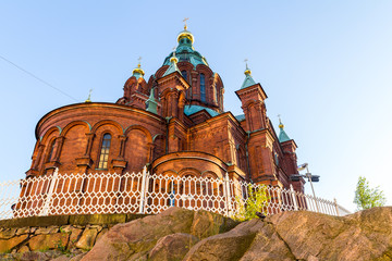 Fototapeta premium Evening scenery of Uspenski Orthodox Cathedral Church in Katajanokka district of the Old Town in Helsinki, Finland