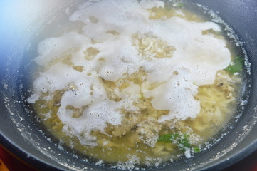 hot boiled rice with minced pork cooking on steamed pot