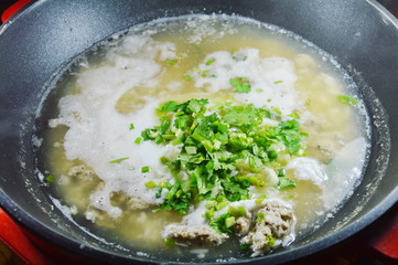 hot boiled rice with minced pork dressing parsley on steamed pot