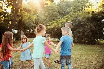 Fototapeta premium Group of playful kids in park