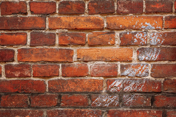 Fototapeta premium Wall made of old brick, has a trace of paint