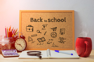 Back to school  concept.Wood boards with text inside BACK TO SCHOOL on table with coffee. office equipment - Powered by Adobe