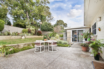 back yard with outdoor seating and barbecue with family. beautiful house