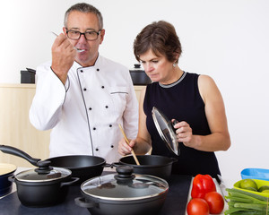 Woman with Chef Cook in the kitchen