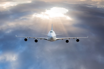 passenger airplane in the clouds.