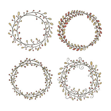 Set of round frames, hand-drawn. Round frame made of branches with leaves and berries. Autumn, vintage colors. Wreath painted by hand.