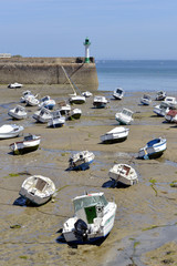 Boats at low tide in the port of Saint-Quay-Portrieux, commune in the Côtes-d'Armor department of...