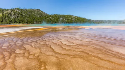 Foto op Canvas Beautiful Grand Prismatic Spring against blue sky. Amazing scenery at Midway Geyser Basin, Yellowstone National Park, Wyoming © khomlyak