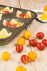 Muffin pan tomato cheese tarts.