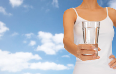 woman hand holding glass of water