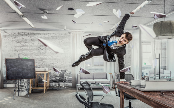 Jumping Businessman In Office . Mixed Media