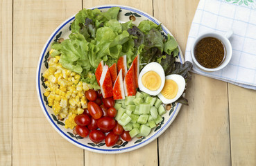 Fresh mixed vegetable salad with boil egg and crab stick and Japanese salad dressing, healthy lifestyle