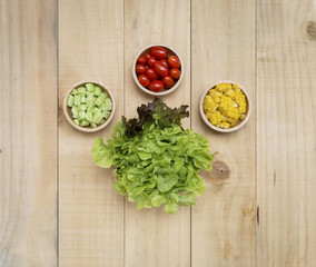 Healthy lifestyle background, fresh vegetables salad on wood background
