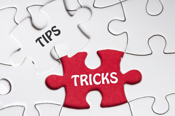 Fototapeta premium Tips and Tricks. Missing Piece Jigsaw Puzzle with word